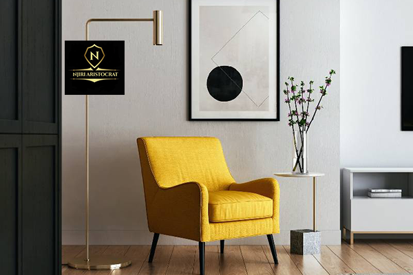 Modern lounge with textured neutral walls and teal chairs